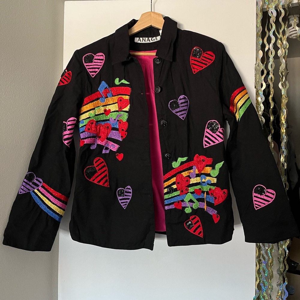 music notes with sequins and rainbow jacket with a funky, retro branded anage